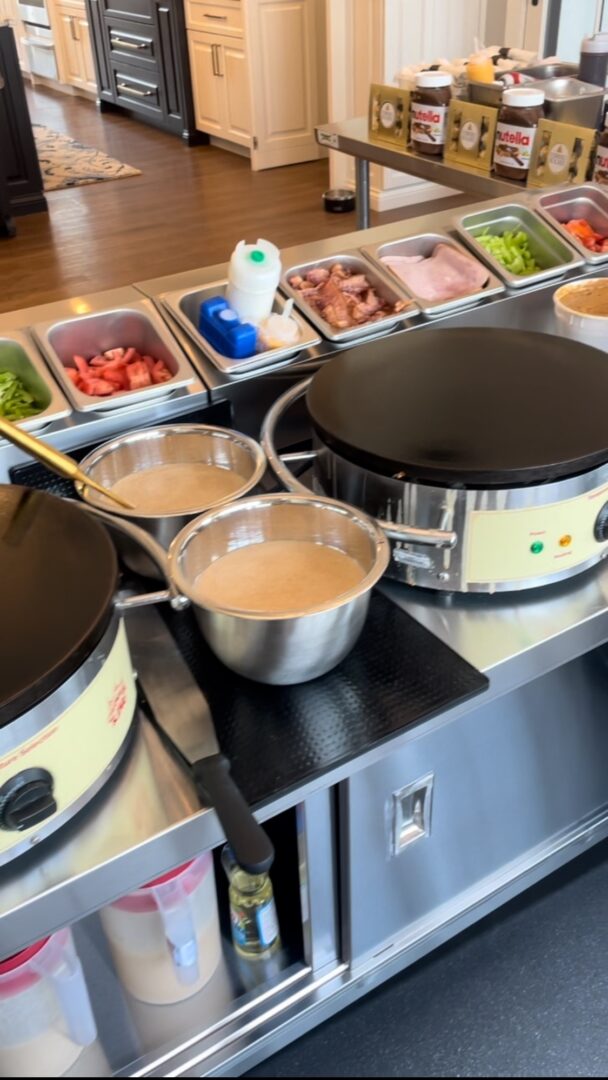 A couple of pots on top of an electric stove.